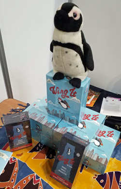 A stack of Wing Its with a toy penguin on top